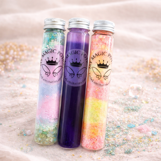 Three gradient bottles labeled 'Magic Potion' with colourful contents on a glittery surface.