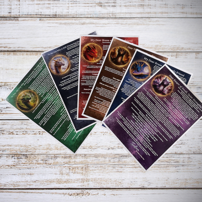 Set of fantasy-themed bookmarks with dragon illustrations on a wooden surface