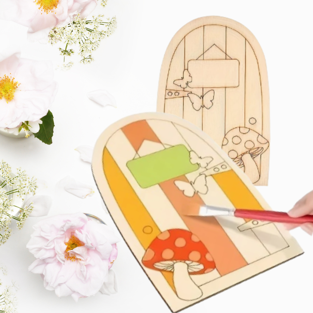 Wooden fairy door with paint and flowers on a white background