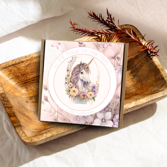 Card with unicorn design on a wooden surface