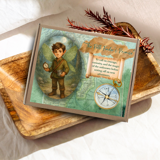 Card with fairy design and compass on a wooden surface